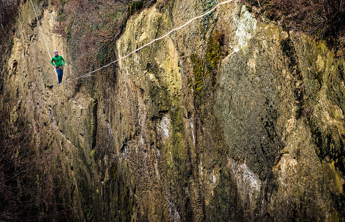 German Slackliner Julian Mittermaier walks across a 113m long and 30m high Highline in Neubeuren, Bavaria, Germany.