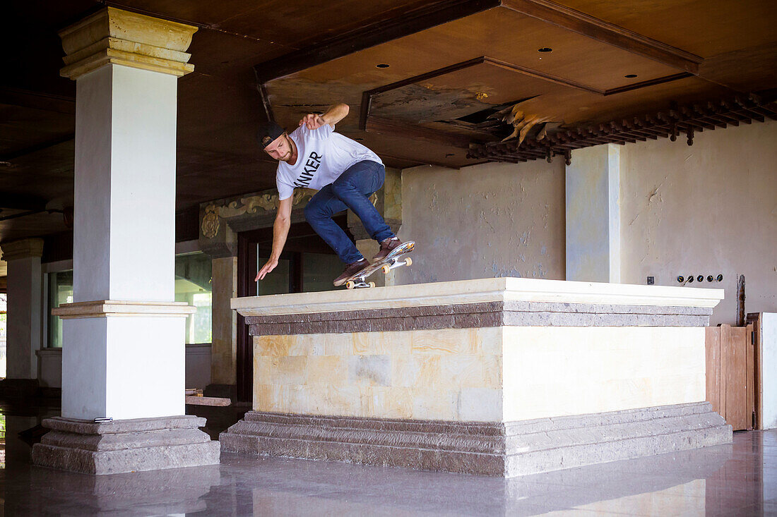 Skateboarding in deserted hotel, Bali, Indonesia.