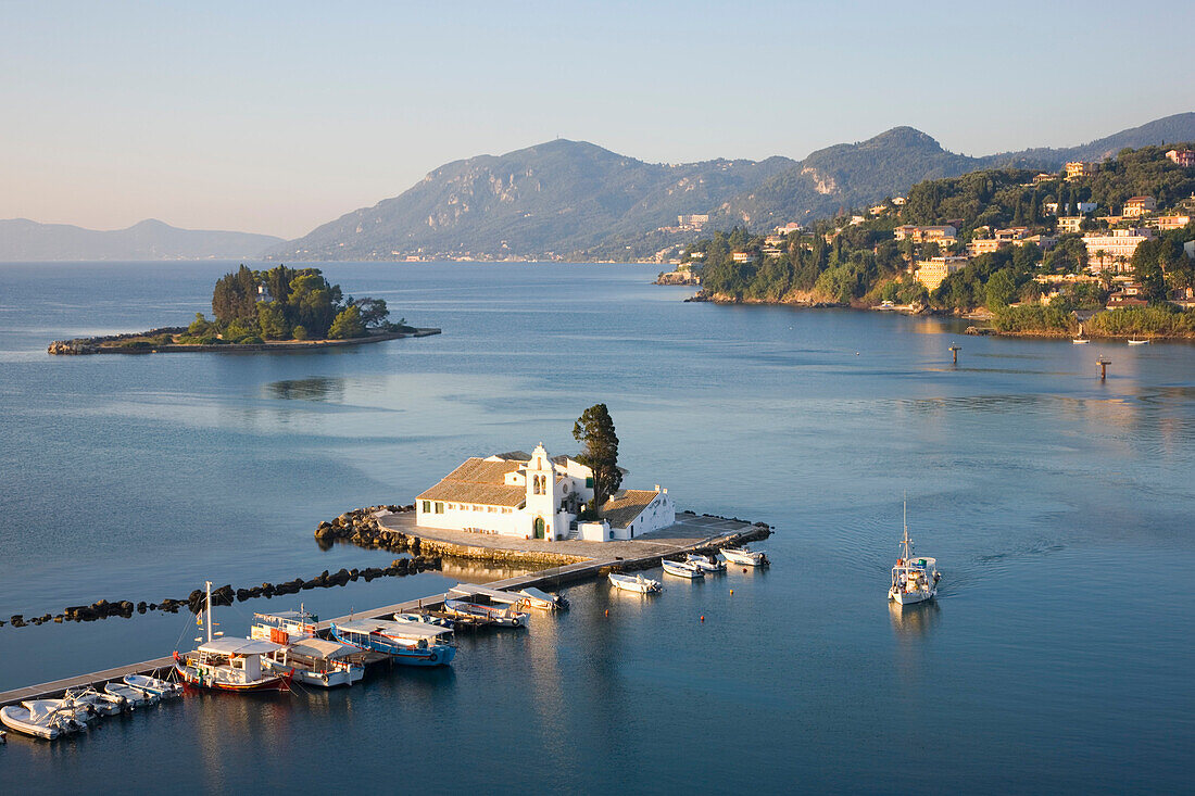 View to the Monastery of Panagia Vlacherna, small boat approaching, Kanoni, Corfu Town, Corfu, Ionian Islands, Greek Islands, Greece, Europe