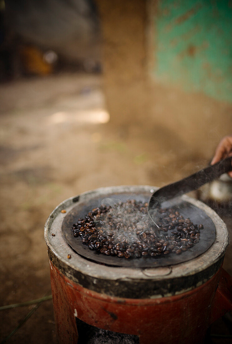 Freshly roasting coffee, Omorate, Omo Valley, Ethiopia, Africa
