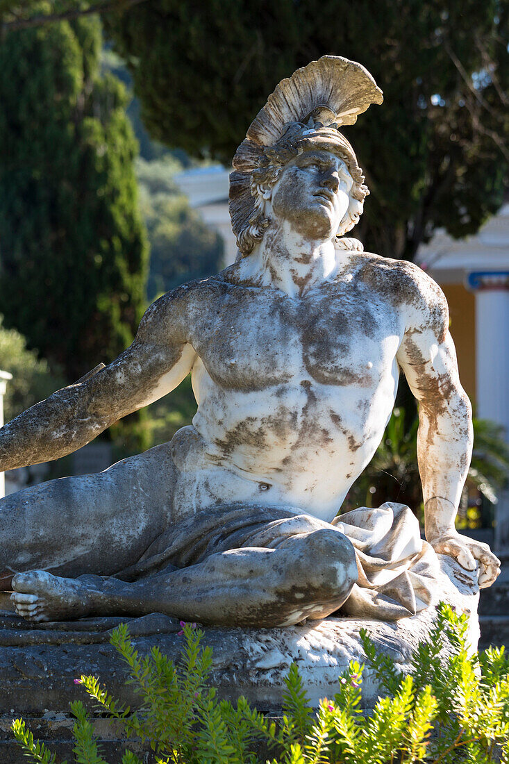 Stone statue of reclining figure of Dying Achilles (Achilleas thniskon) at Achilleion Palace, Museo Achilleio, in Corfu, Greek Islands, Greee, Europe