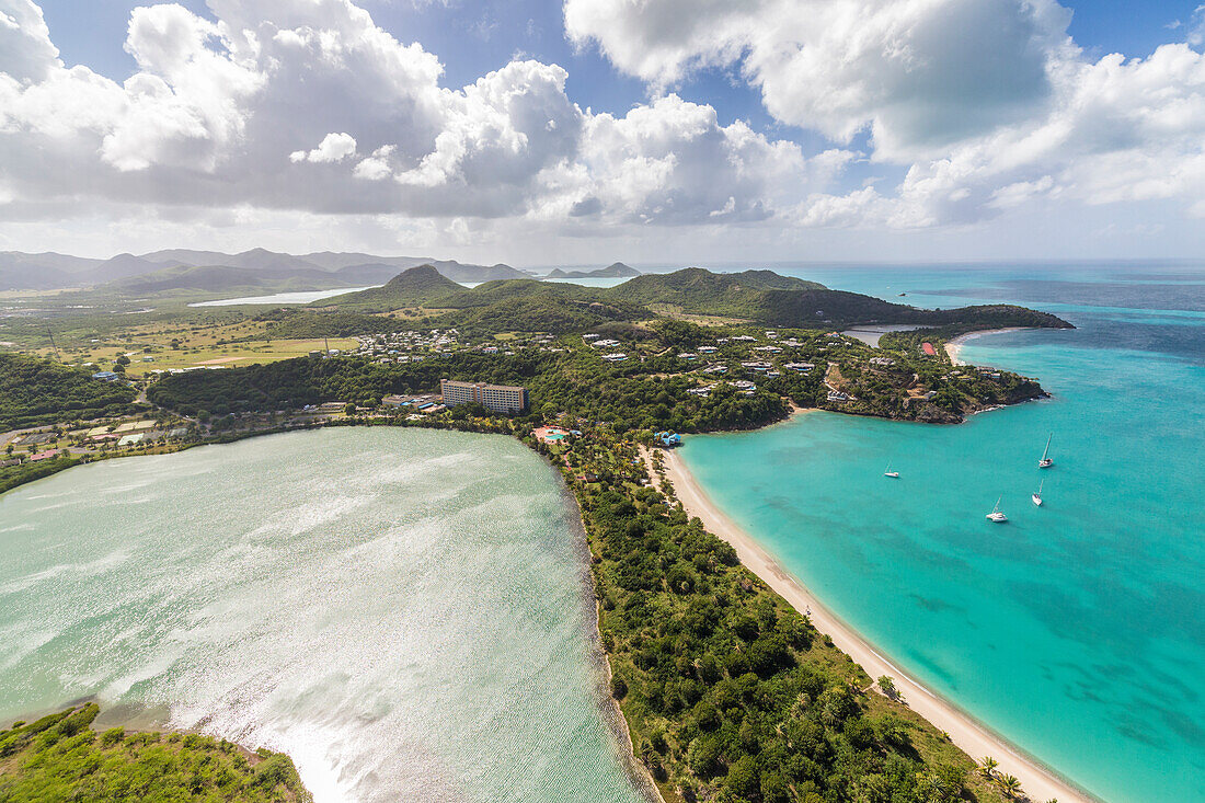 Aerial view of a lagoon on the Caribbean island of Antigua a thin line of sand divides the small salt basin from the sea, Antigua, Leeward Islands, West Indies, Caribbean, Central America