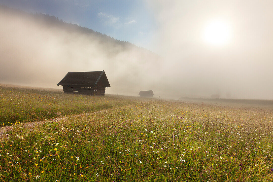 Haystack on a meadow at Geroldsee, view to Karwendel, Werdenfels region, Bavaria, Germany