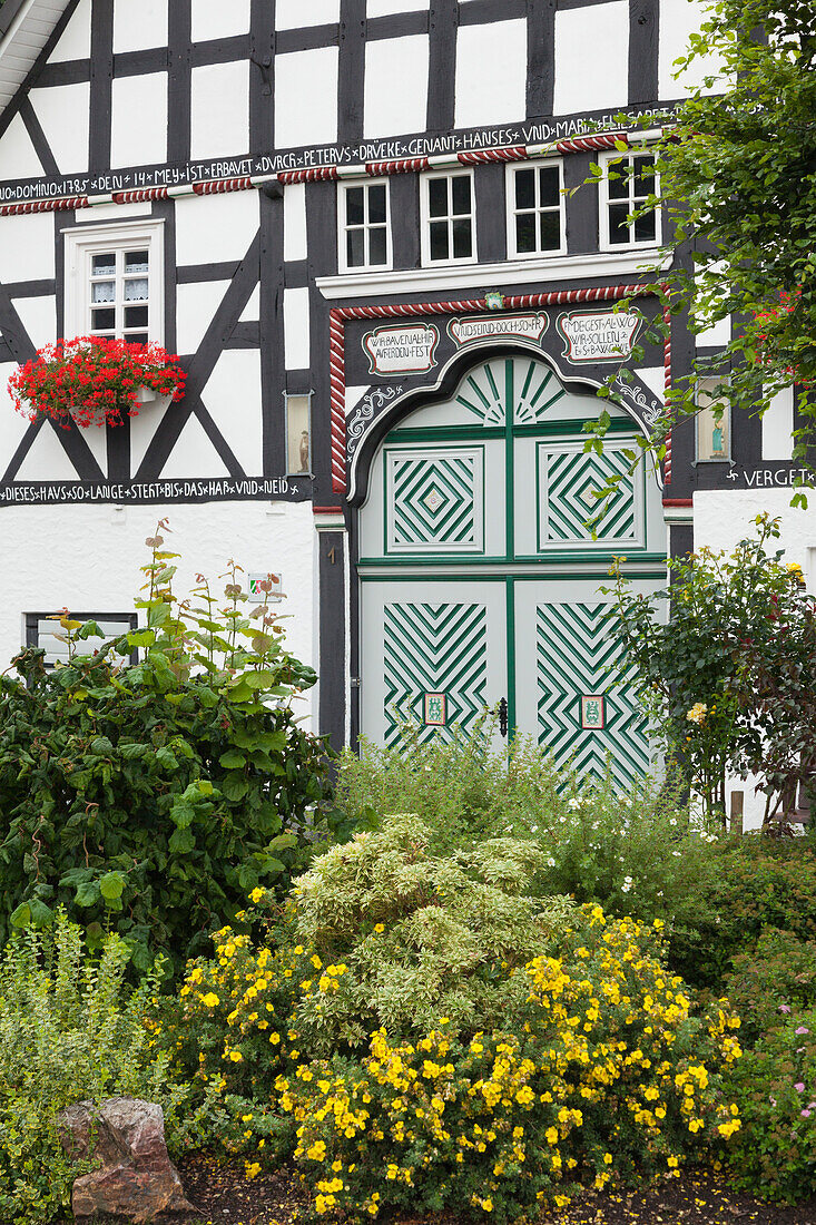 Half-timbered house in the village Kirchveischede, near Lennestadt, Rothaargebirge, Sauerland region, North Rhine-Westphalia, Germany