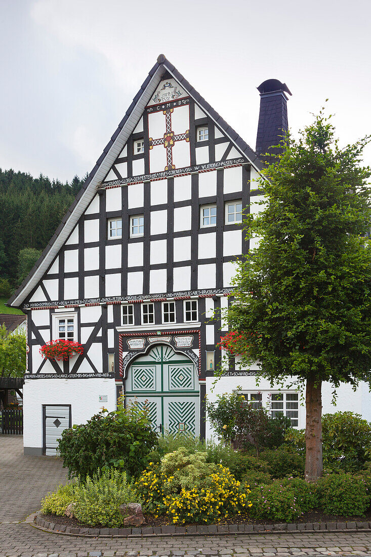 Half-timbered house in the village Kirchveischede, near Lennestadt, Rothaargebirge, Sauerland region, North Rhine-Westphalia, Germany