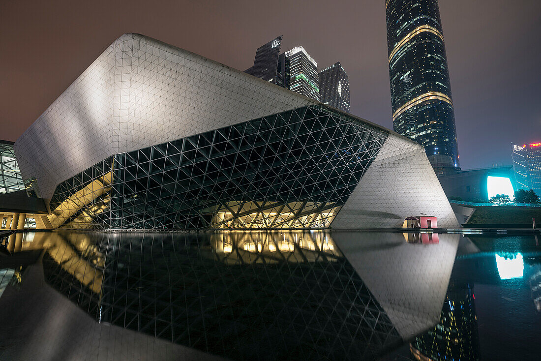 Opera house by Zara Hadid at night, Downtown Guangzhou, Guangdong province, Pearl River Delta, China