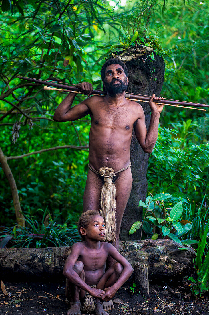 Father and son pose for a photograph at Yakel Village, Tanna Island, Vanuatu