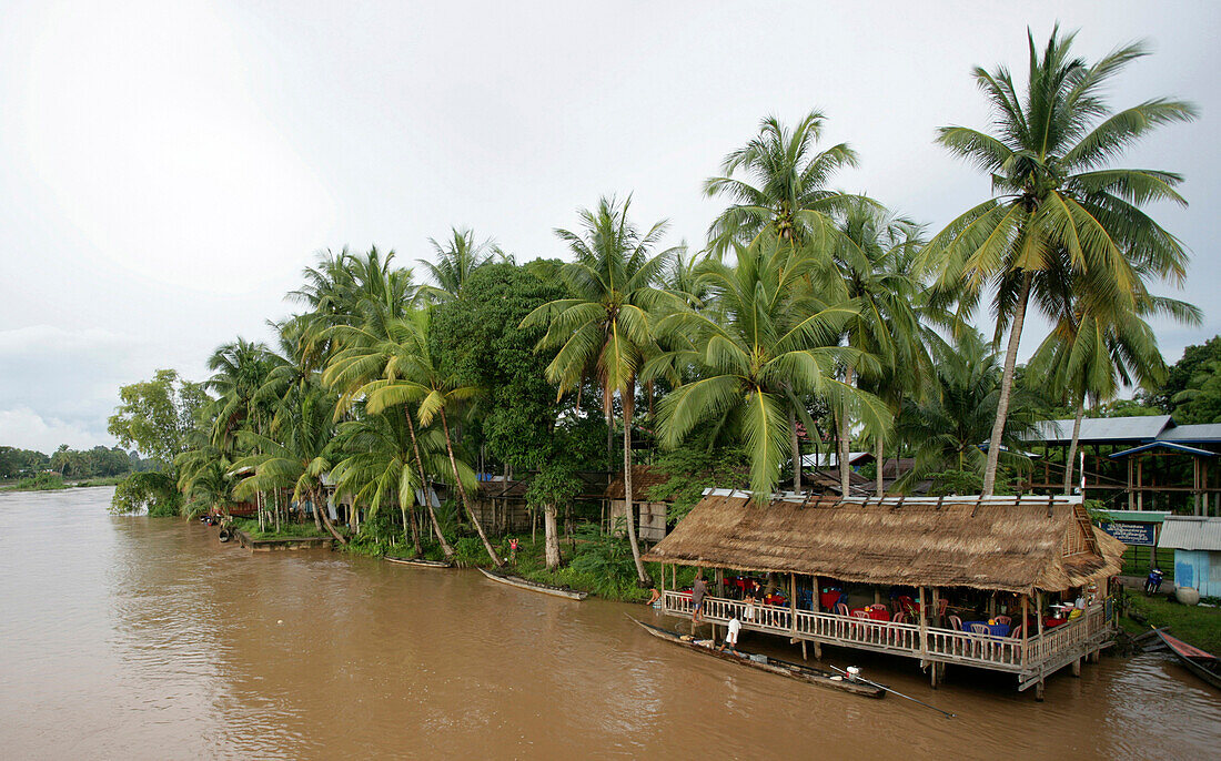 Building filled with people along the Mekong River, Don Det Island, Champasak Province, Laso