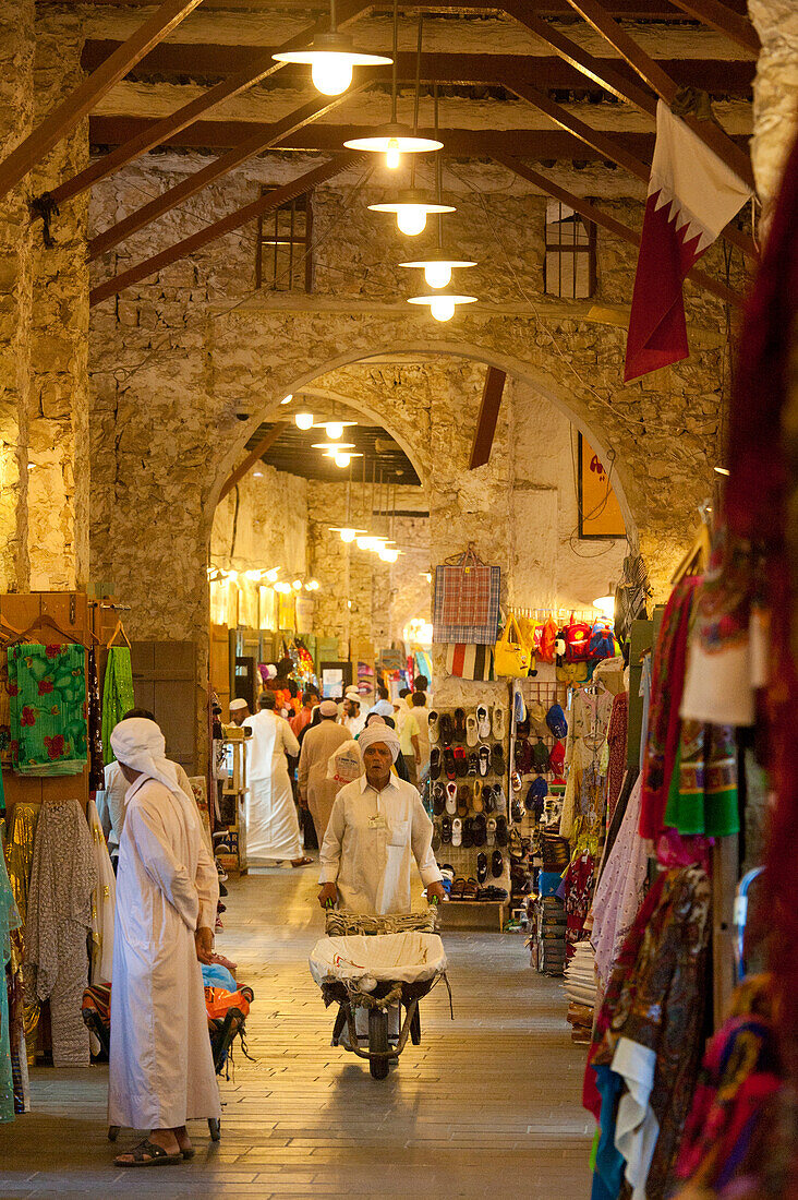 Porter with wheelbarrow in the Wafi Souk, Doha, Qatar