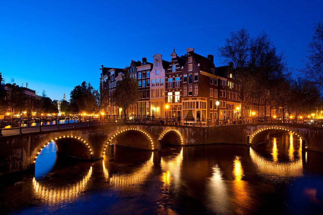Bridges over canals at dusk, Amsterdam, Holland