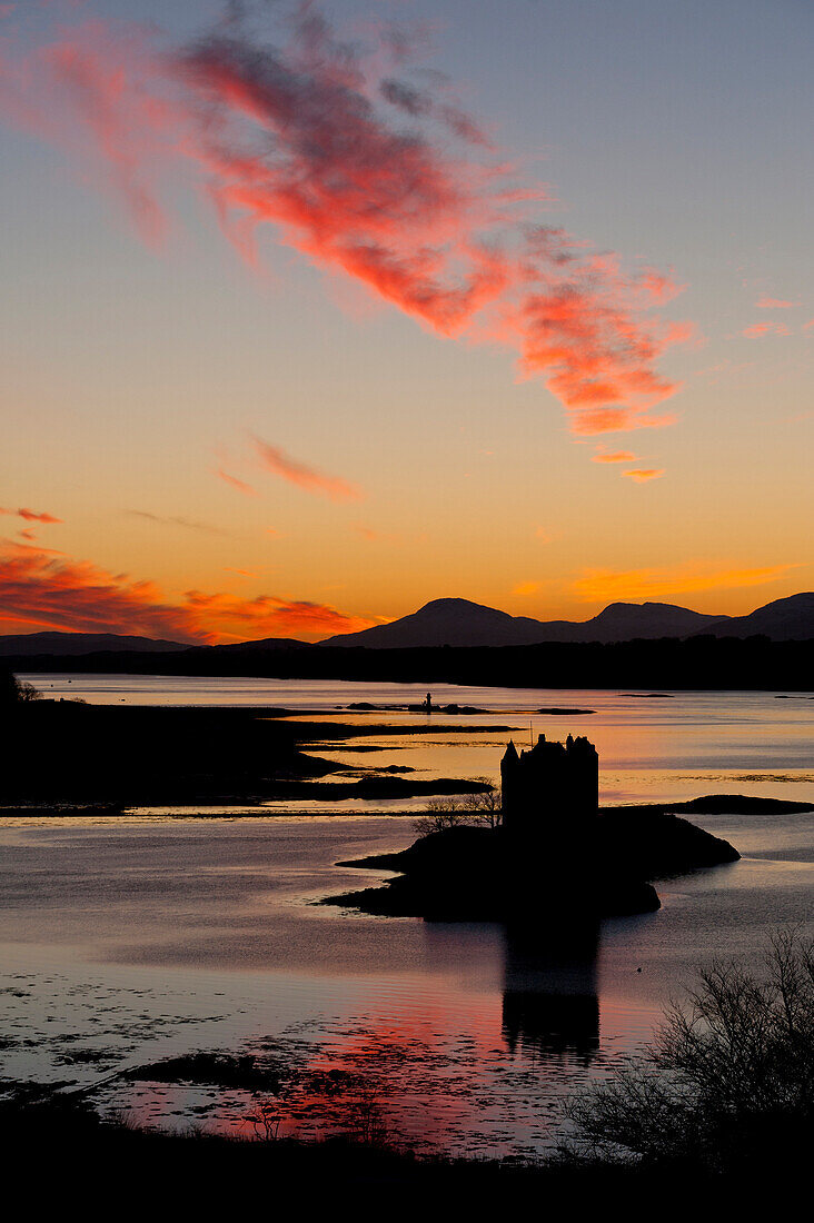 Silhouette of Castle Stalker at dusk, Appin, Argyll and Bute, Scotland