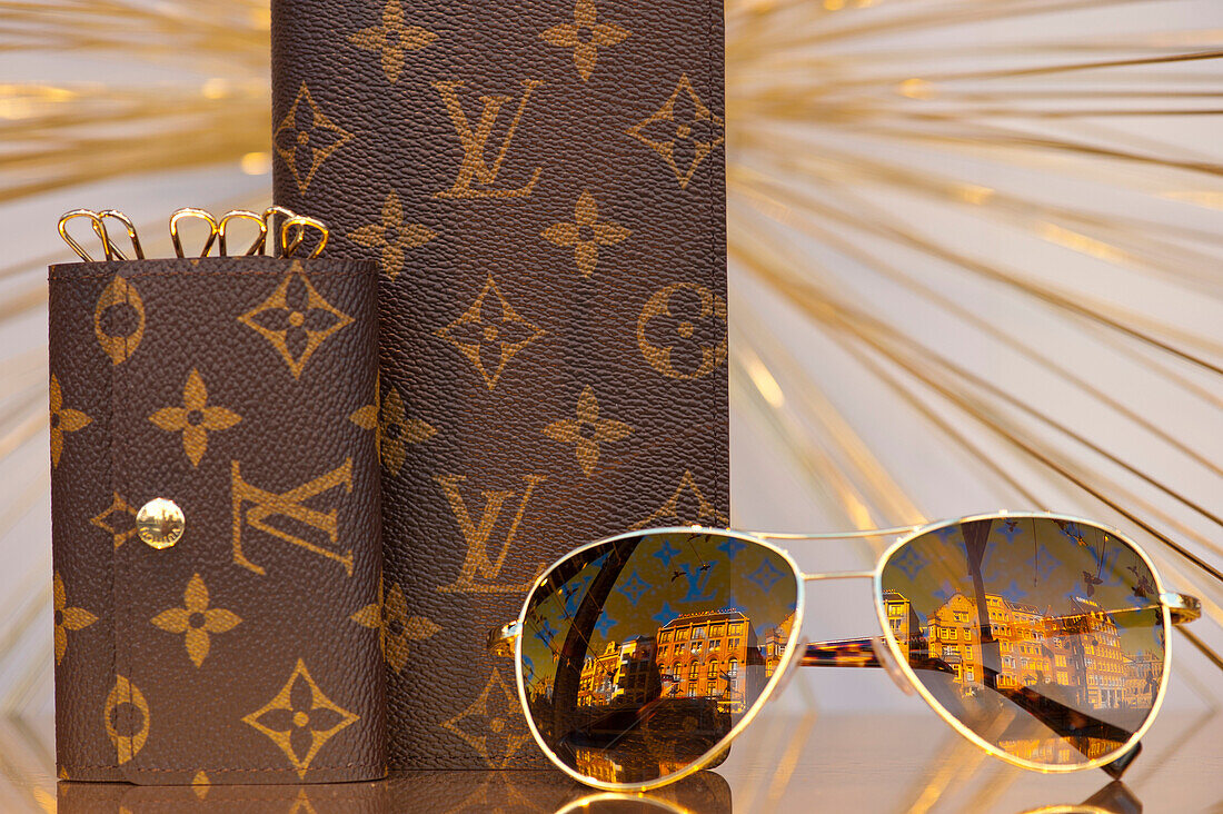 Louis Vuitton glasses and purses on display in window of De Bijenkorf, Amsterdam, Holland