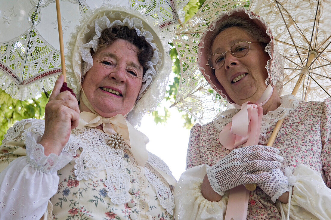Women as costumed characters in St. Peter's village tour, Broadstairs, Kent, England