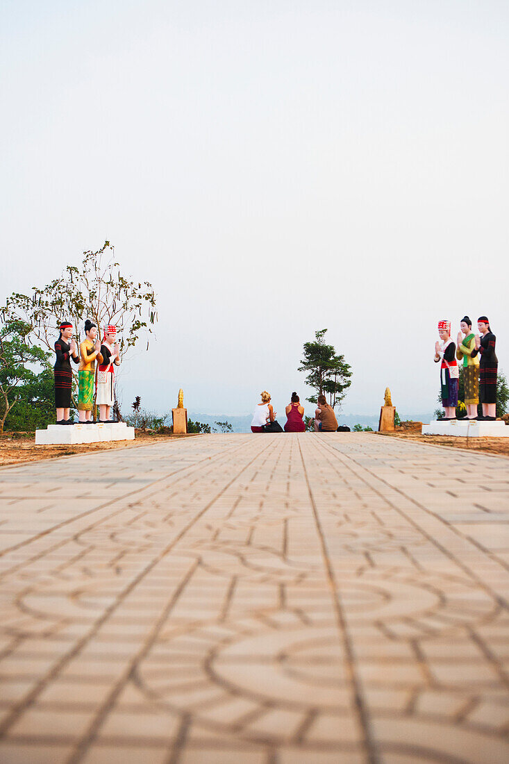 Relaxing atop the hilltop stupa, Luang Namtha, Laos