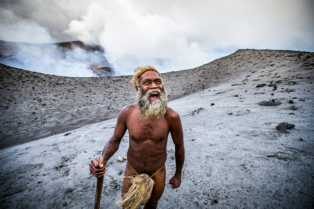 A local landowner standing at the rim of Yasur Volcano, Tanna Island, Vanuatu