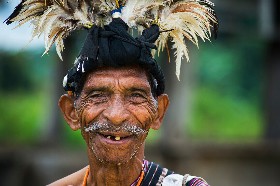 Elderly man in traditional attire, Lospalmos district, Timor-Leste
