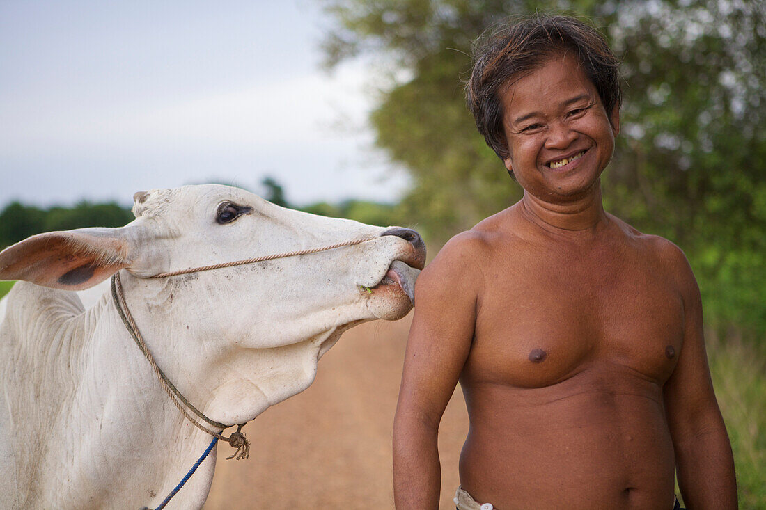 'A man and his cow; Battambang, Cambodia'