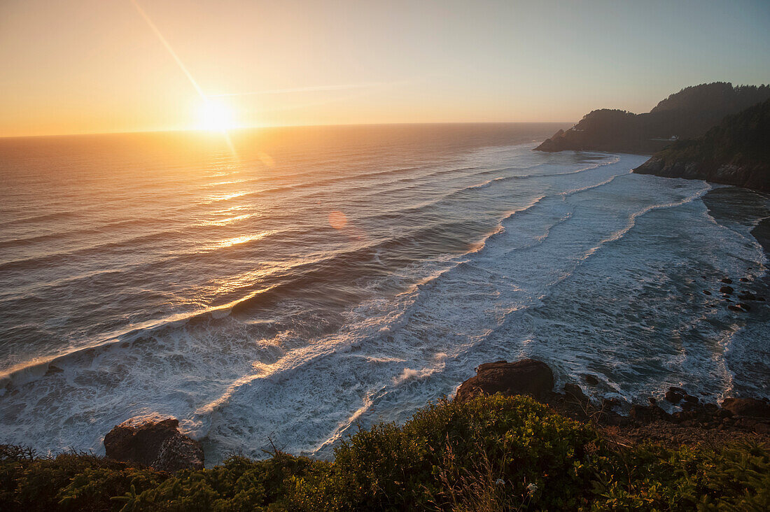 'Waves lapping the coast at dusk; Oregon, United States of America'