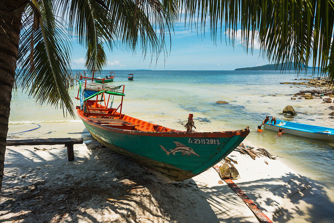 'Boats on the white sand shore of Koh Rong Island; Sihanoukville, Cambodia'
