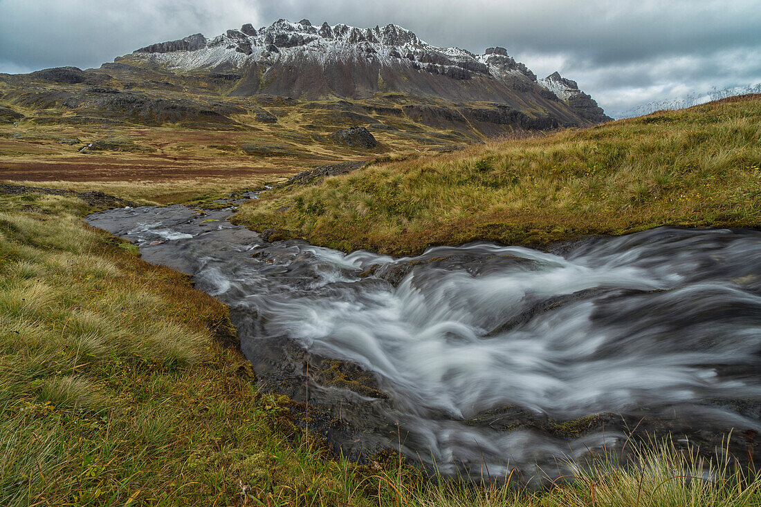 'One of the numerous streams coming from the mountains in the West Fjords region of Iceland; Iceland'