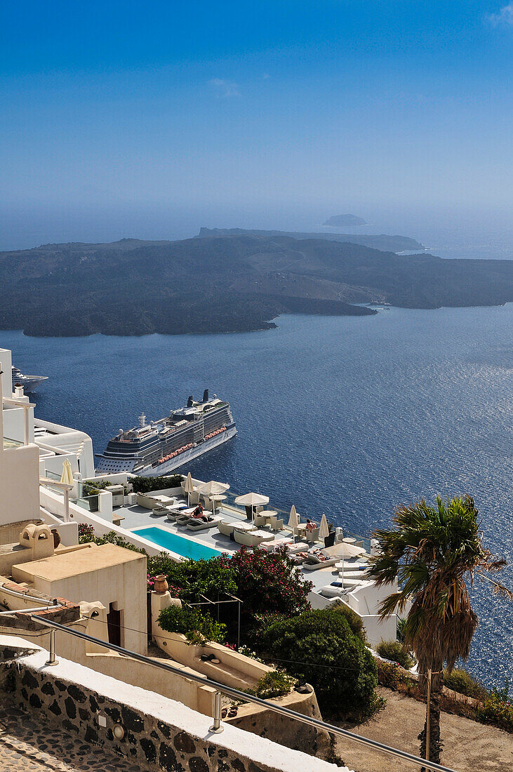 'Ships in the harbour of Thera, with the Island of Nea Kameni in the background; Thera, Santorini, Greece'