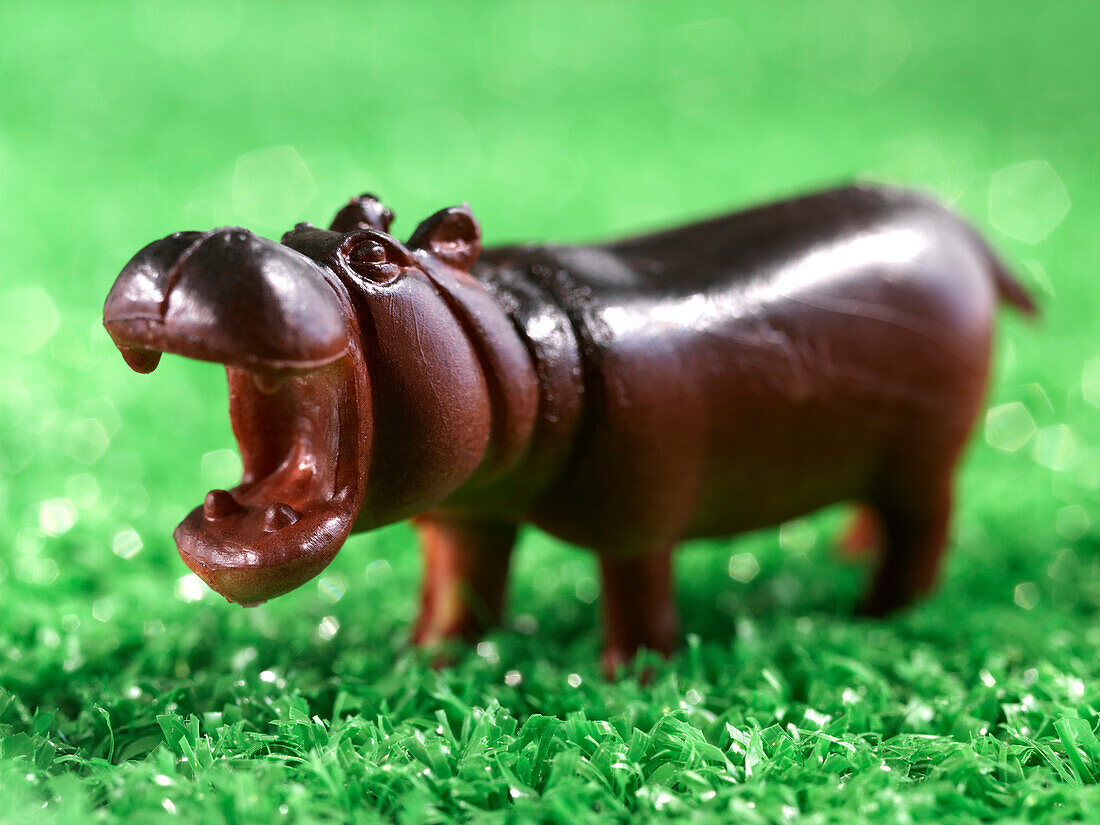 Close Up Of Miniature Toy Hippo On Artificial Grass