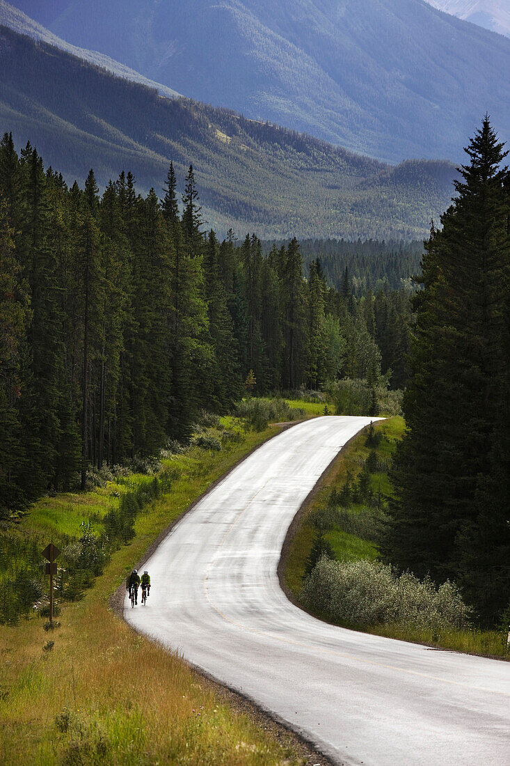 2 Cyclists In Banff National Park, Alberta, Canada