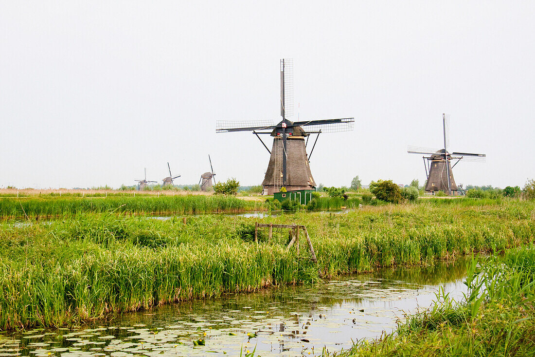 Windmills, Built Around 1740 Along Nieuwe Waterschap To Drain The Excess Water From The Alblasserwaard Polders, Kinderdijk, Netherlands