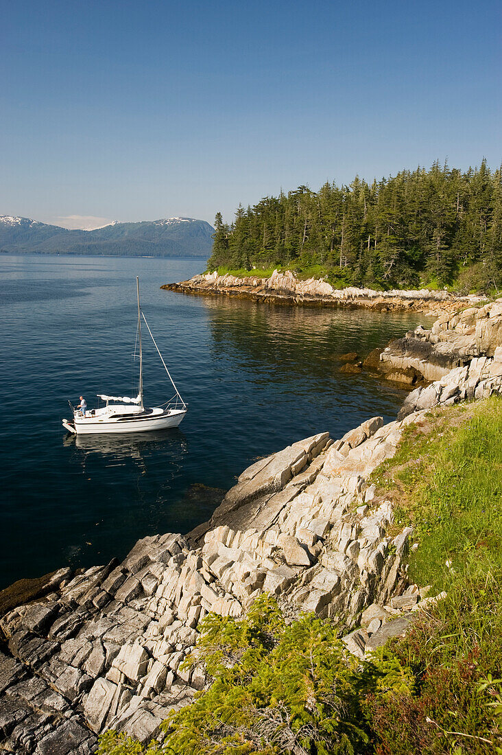 Sailboat anchored off of Perry Island in Prince William Sound, Southcentral Alaska.