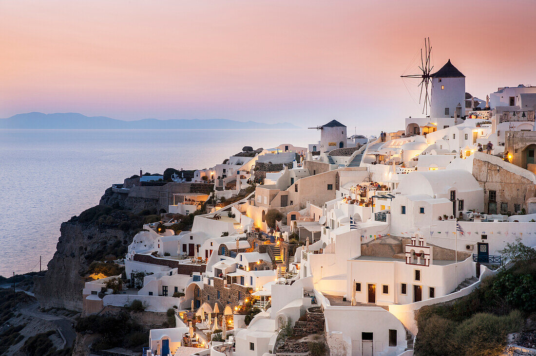 Whitewash buildings and windmill at dusk, Oia, Santorini, Greece