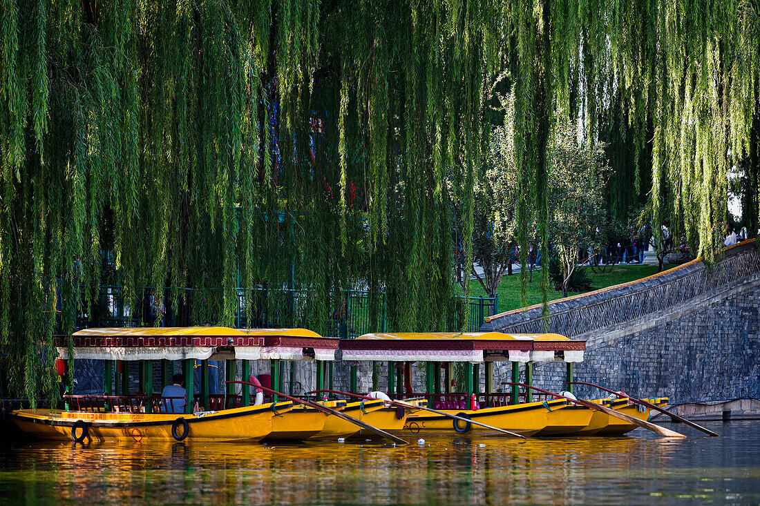 Pleasure boats on the lake in Behai Park, Beijing, China