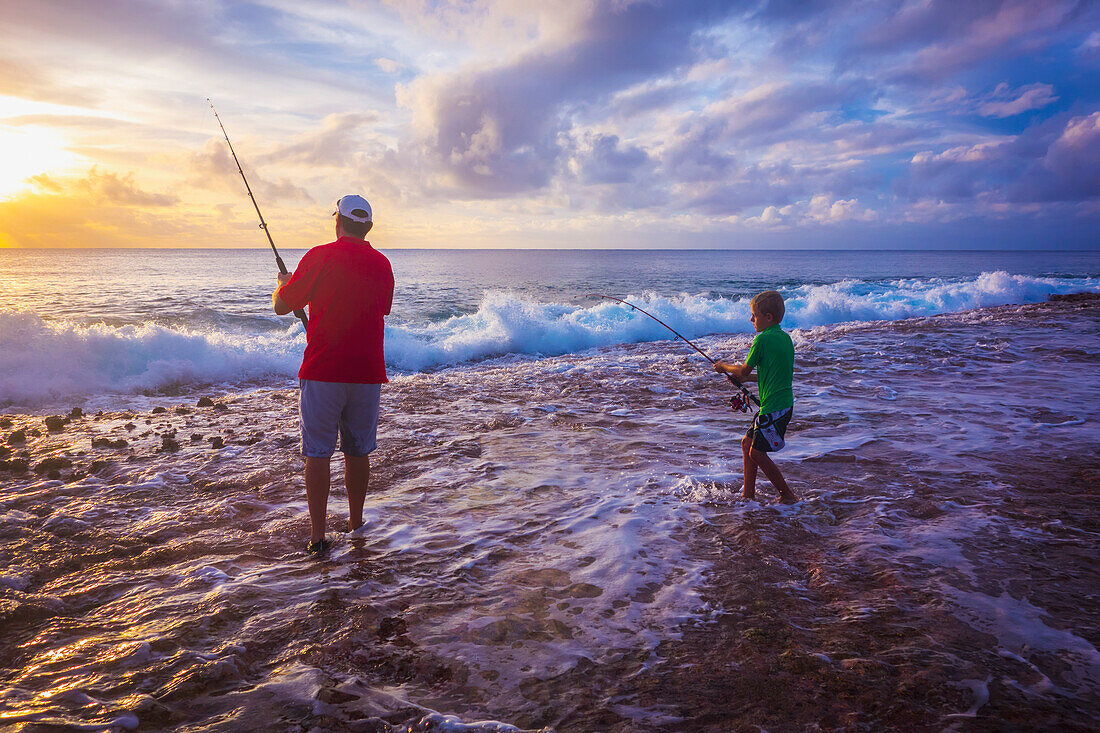 Father and son fishing on Niue Island, Niue