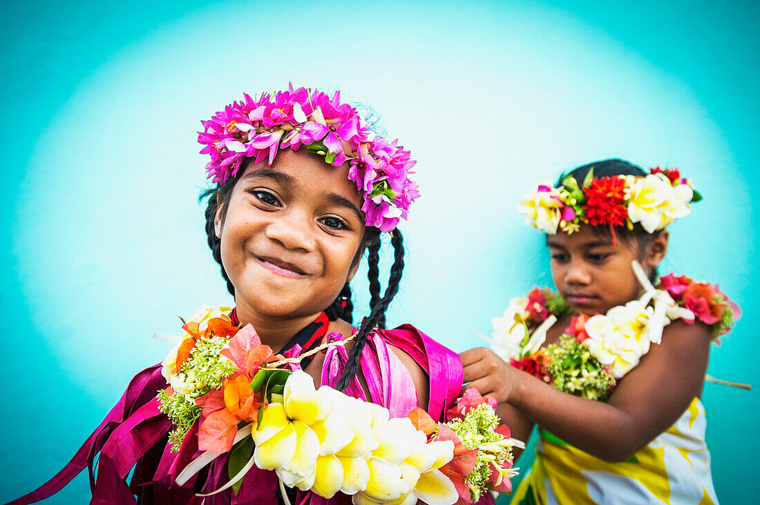 Two young girls in fresh floral garlands, Tuvalu