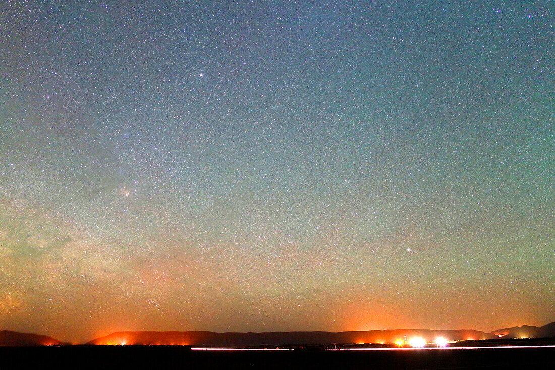 Morocco, Draa Valley, Zagora region, Starry sky (region of Sagittarius and Centaurus) and Milky Way over the desert and Moroccan villages