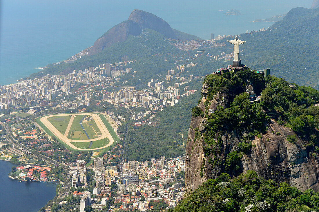 Aerial view from helicopter to Christ the Redeemer statue located at the top of Corcovado mountain in Rio de Janeiro, Brazil, South America