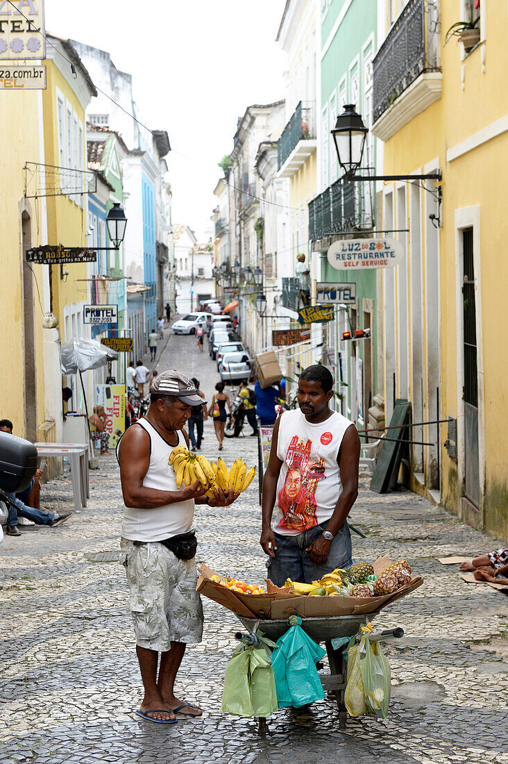 Street vendor in Salvador da Bahia, the city of the Holy Saviour of the Bay of all Saints on the northeast coast of Brazil , South America
