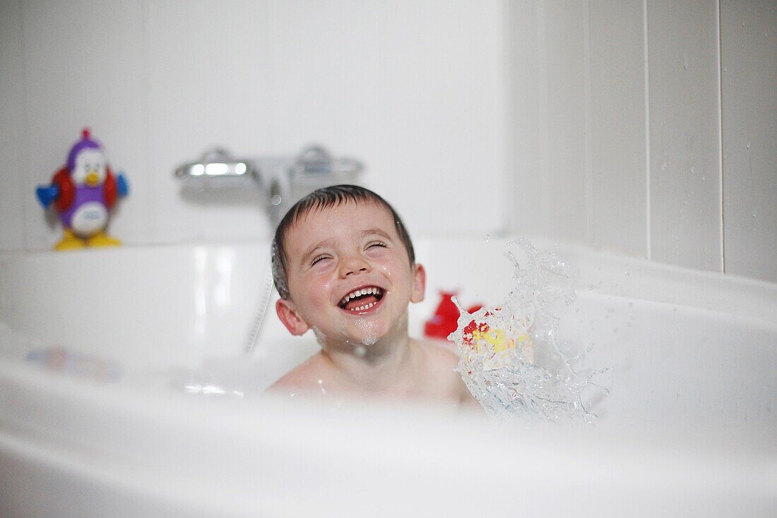 Little boy taking a bath