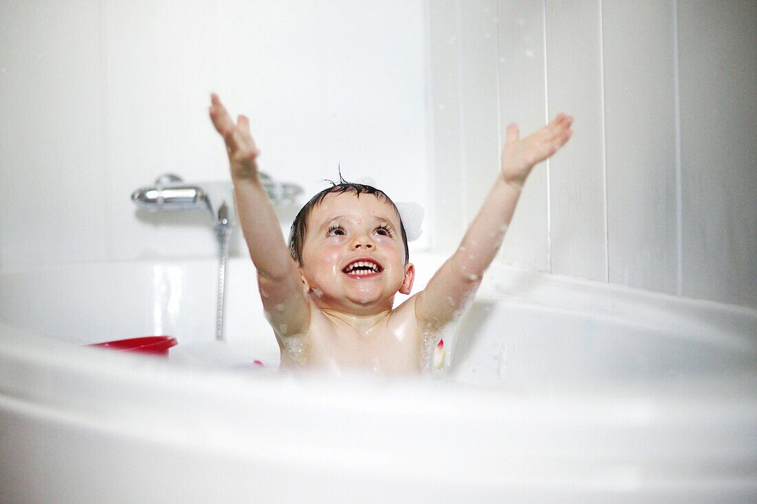 Little boy taking a bath