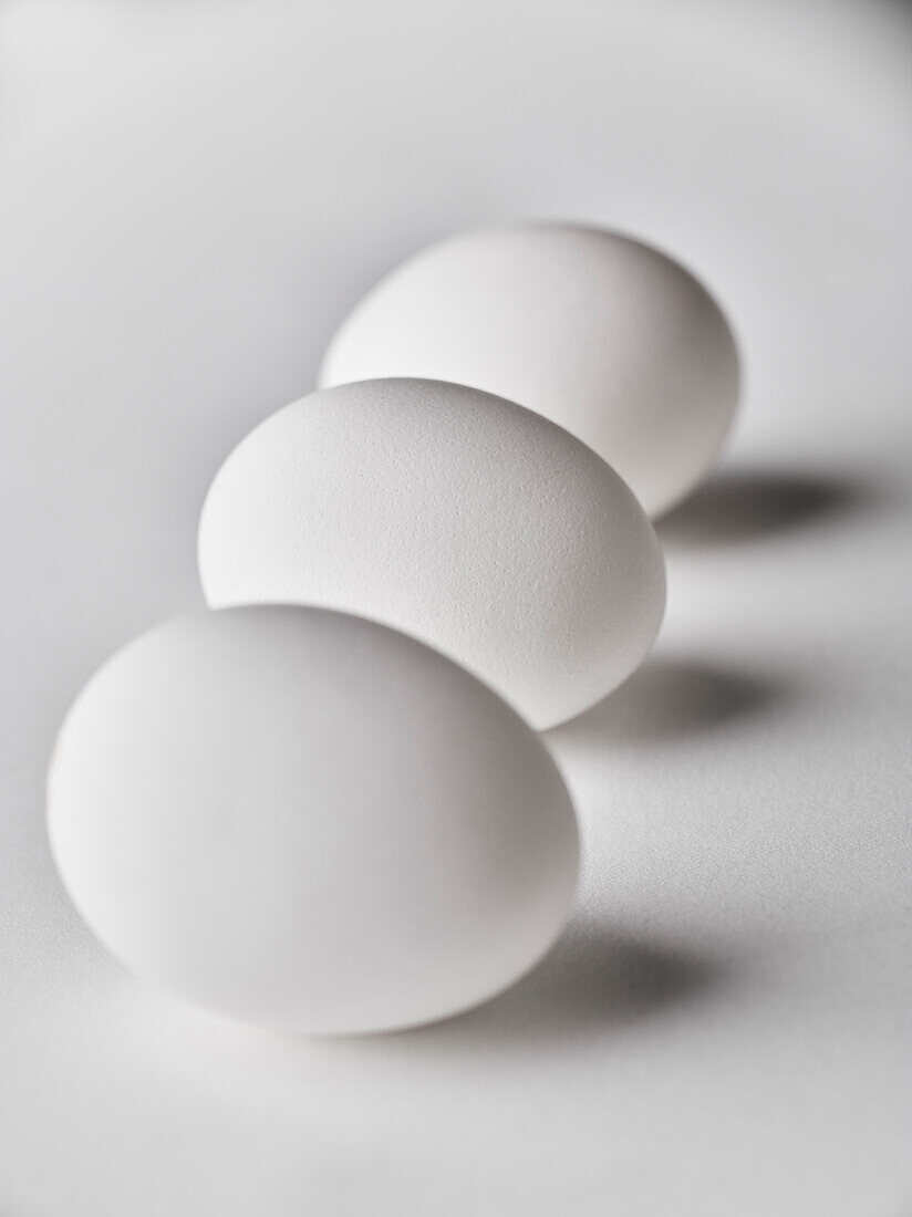 Close up of three white eggs