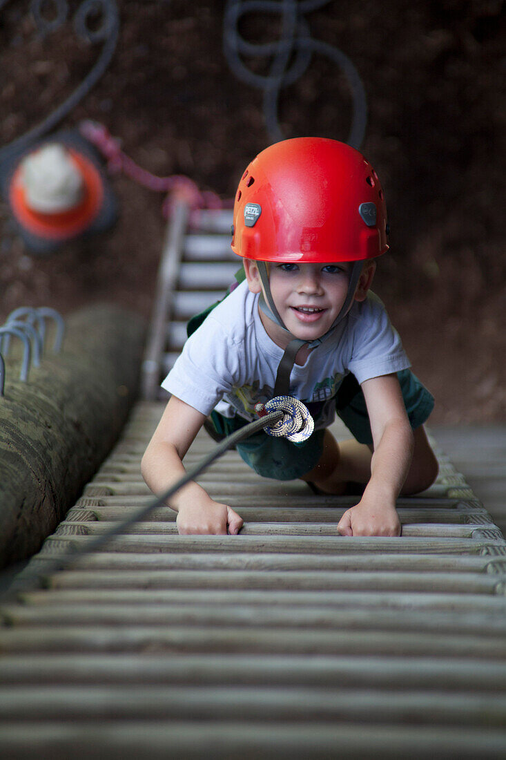 Smiling Boy Climbing Ladder, High Angle View
