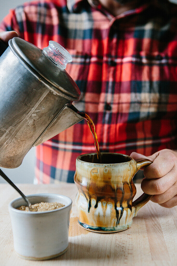 Man Pouring Coffee into Cup
