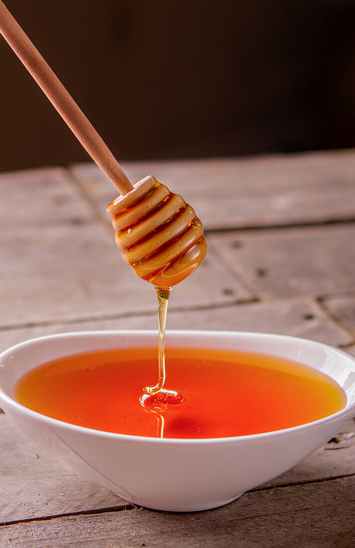Honey Dripping into Bowl
