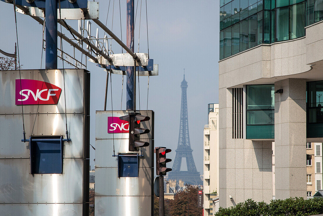 entrance to the montparnasse train station (sncf logo) and the eiffel tower, paris (75), france