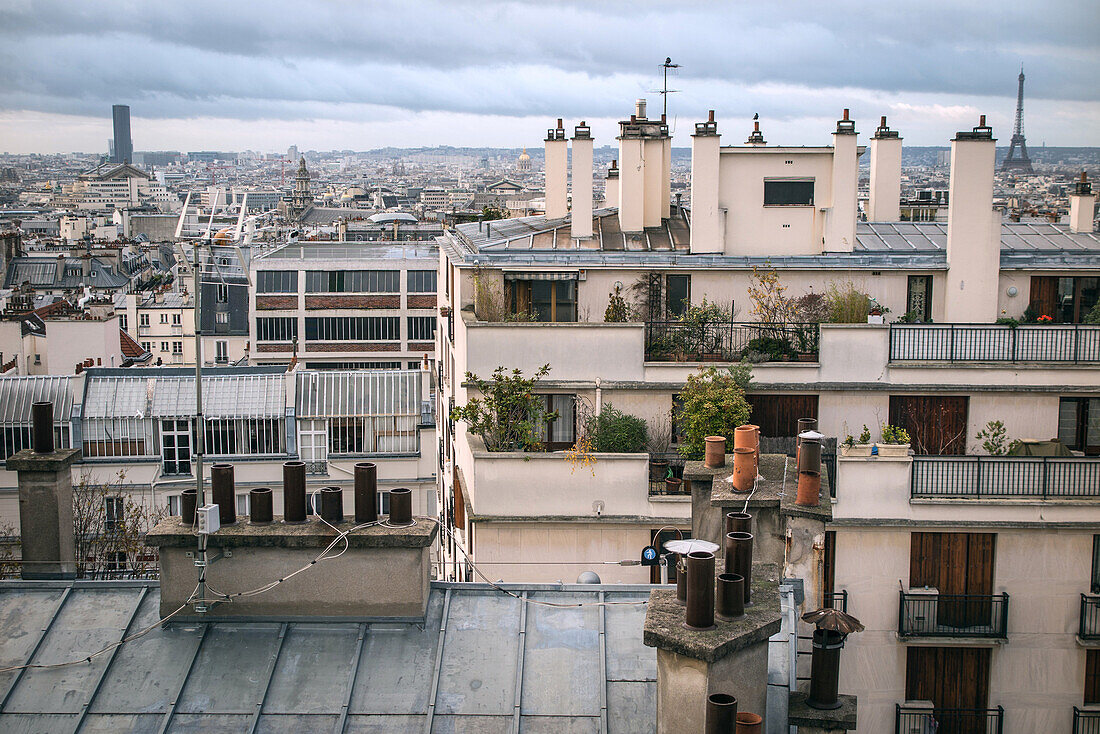 apartment building chimneys on the roofs of paris