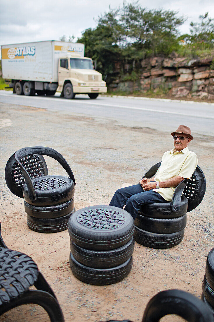 Helio Barbosa, 80 years, former prospector,  Garimpeiro, furniture made from old tires on BR-242, gift shopand restaurant Cabana do Louro, at Posso do Diabo Waterfall, northern border of the Chapada Diamantina National Park, Bahia, Brazil