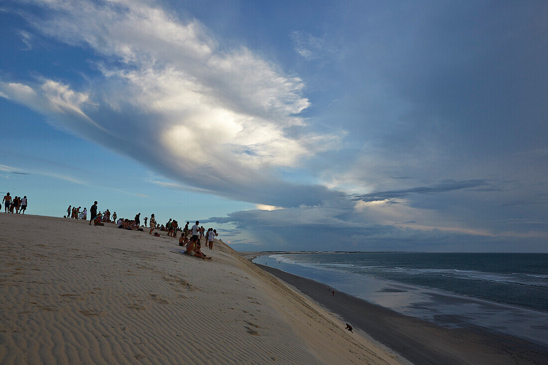 Duna do Por do Sol (Sunset Dune), tourists in the evening on a dune at the beach, Jericoacoara National Park, near Jericoacoara, Ceara, Brazil