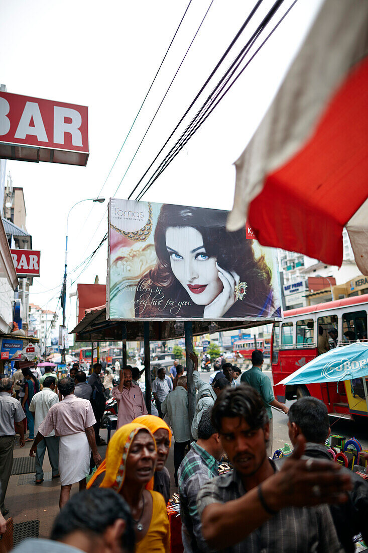 Advertisement at a bus stop on the main street in Ernakulam, business center, in Kochi, Kerala, India