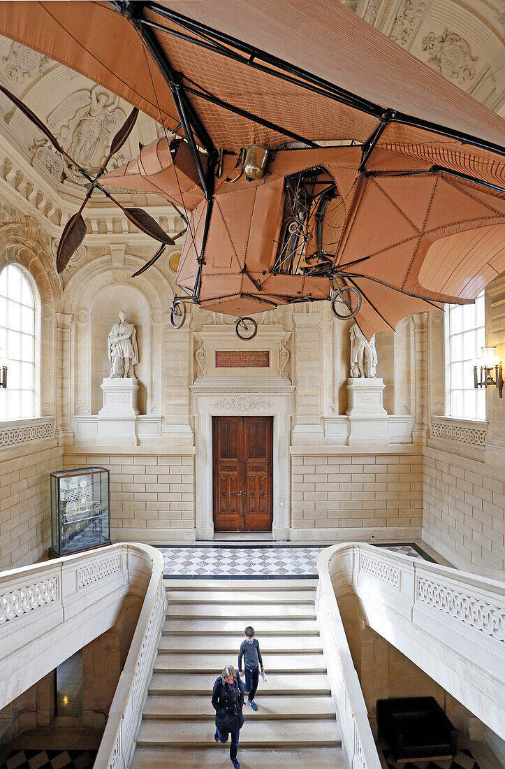 France,Paris, 3rd district, Museum of Arts and Crafts, The grand staircase, Visitors passing under Plane 3 Clément Ader