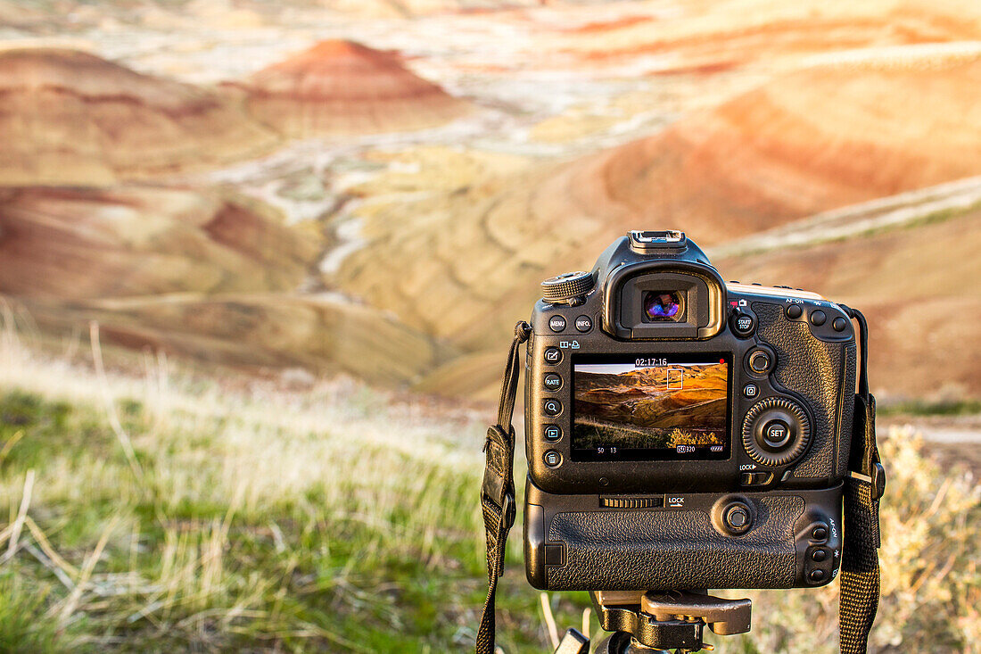 Camera photographing desert landscape, Painted Hills, Oregon, United States