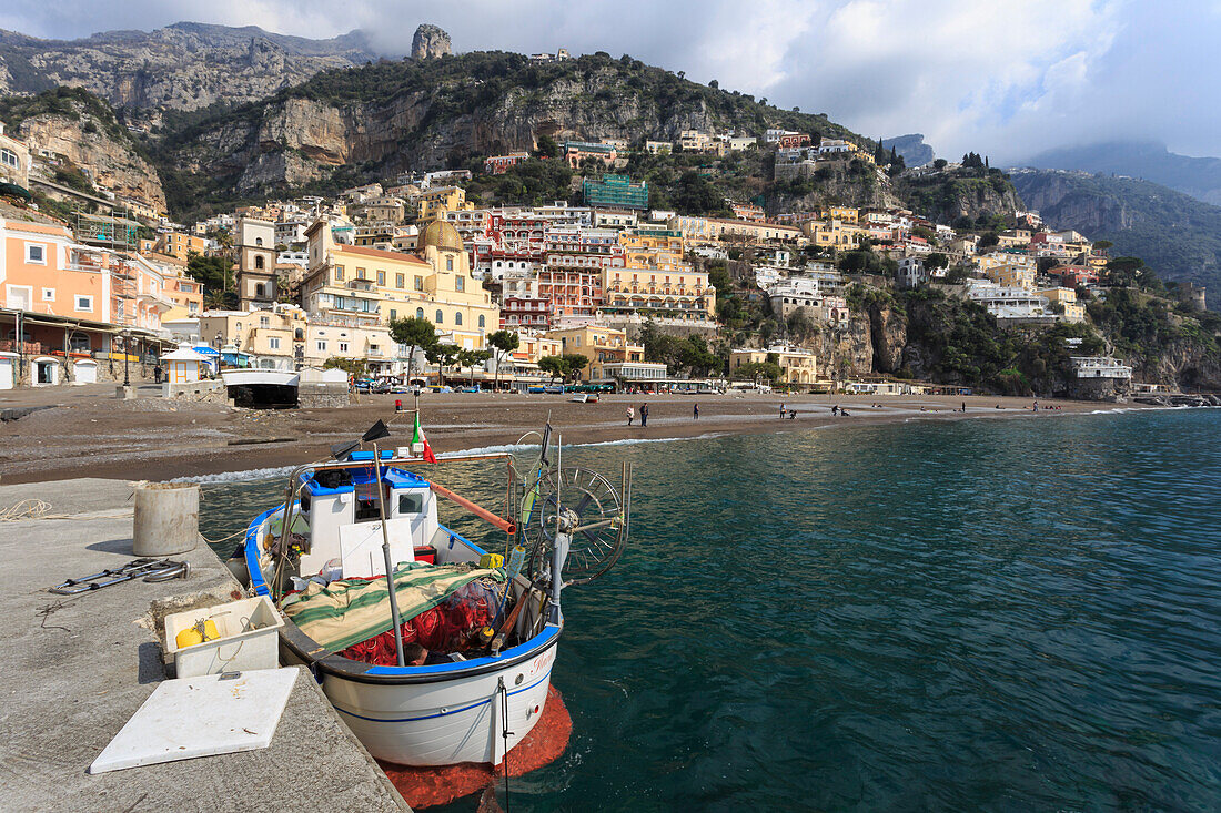 Fishing boat at quayside and Positano town, Costiera Amalfitana (Amalfi Coast), UNESCO World Heritage Site, Campania, Italy, Europe